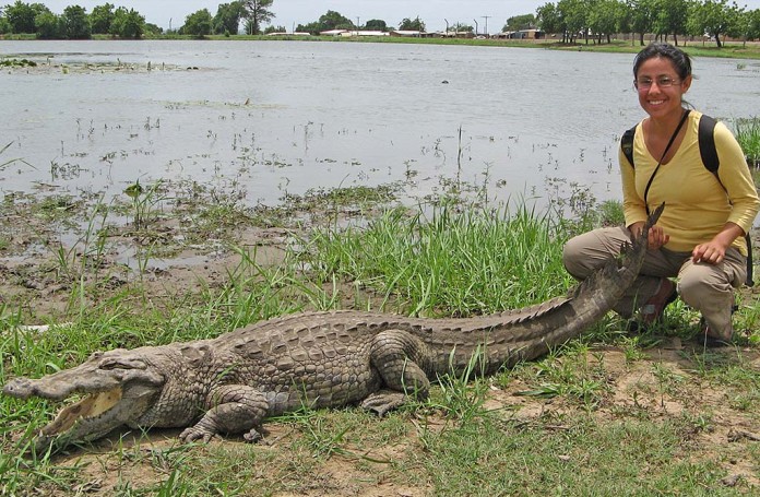 A visitor at the Paga Crocodile Pond in Ghana