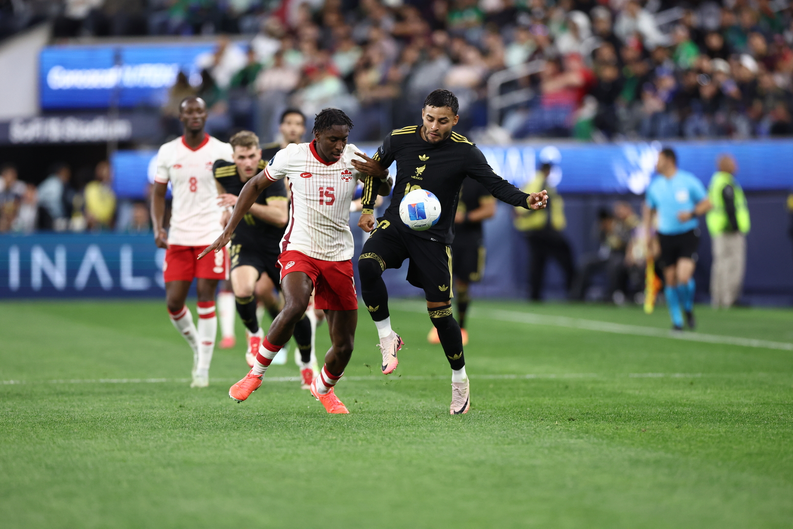 Jamaica and Mexico footballers contest the ball during a CONCACAF match