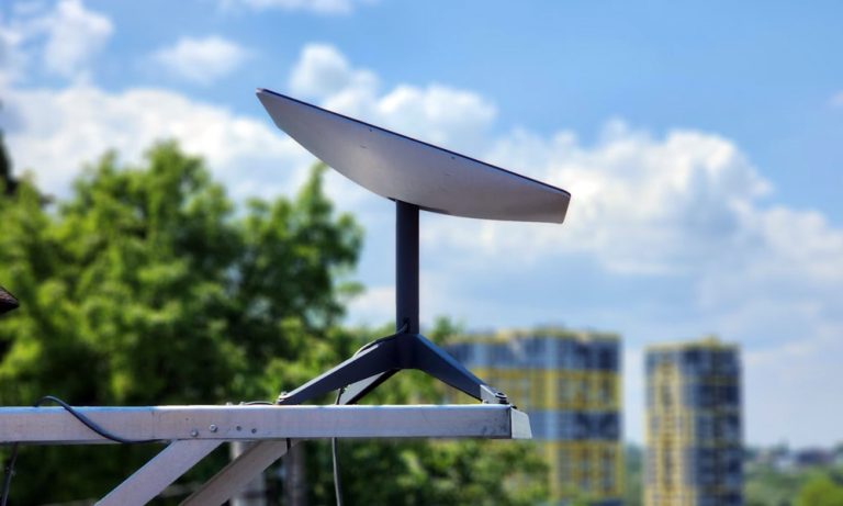 Starlink satellite internet equipment against a sky backdrop
